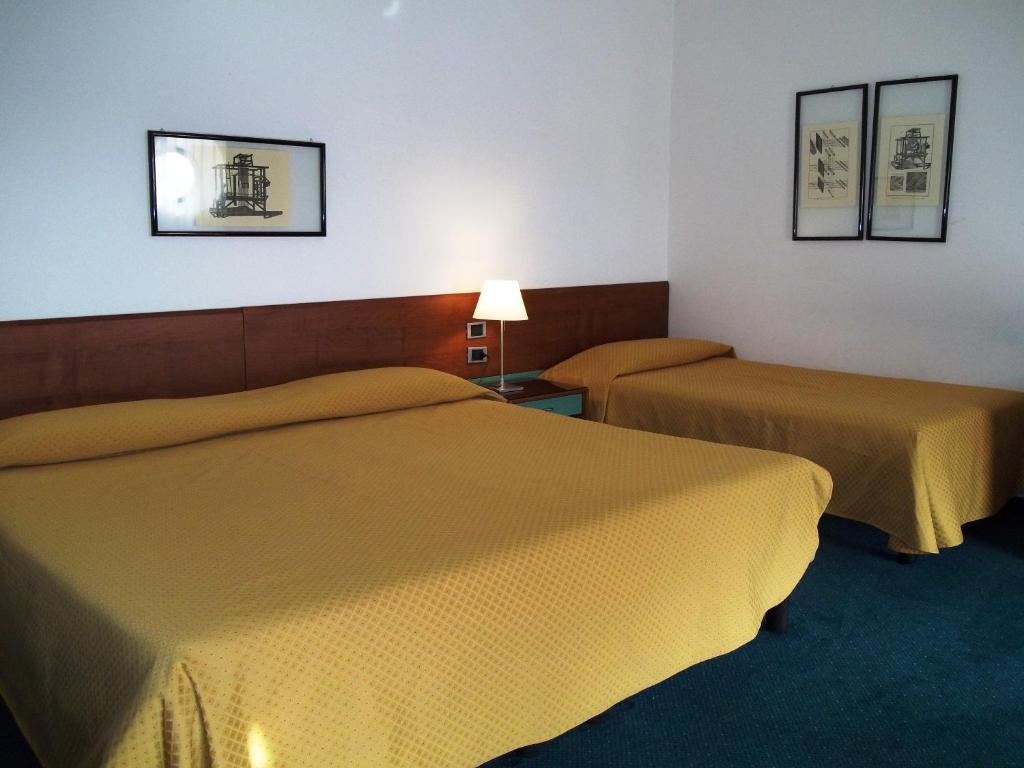 Postel nebo postele na pokoji v ubytování Hotel Filanda