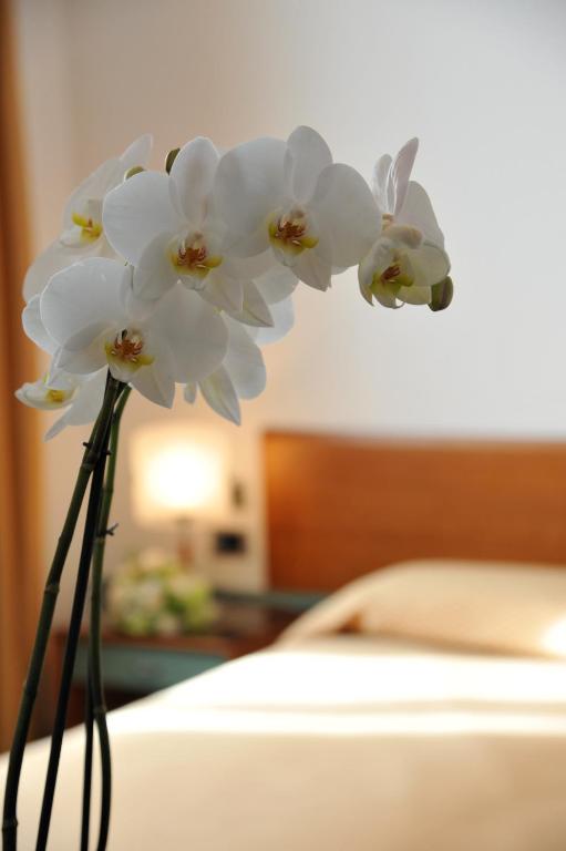 Postel nebo postele na pokoji v ubytování Hotel Filanda
