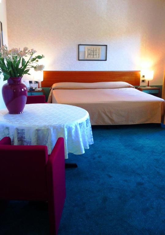 Postel nebo postele na pokoji v ubytování Hotel Filanda