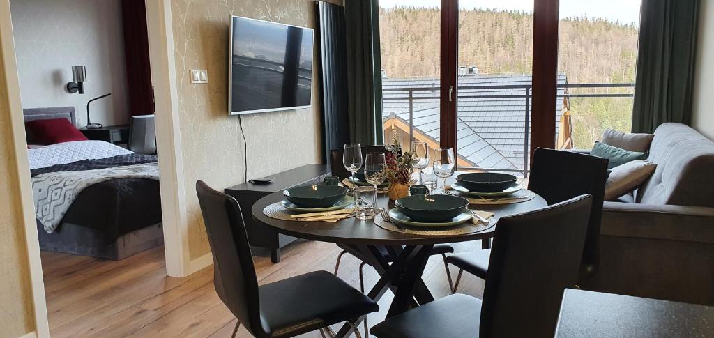 Posteľ alebo postele v izbe v ubytovaní Karpatia Resort Apartament Krystallos