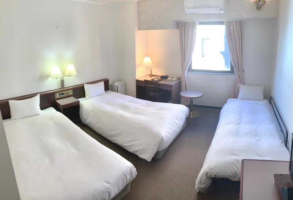 Postel nebo postele na pokoji v ubytování Hotel Ascent Hamamatsu
