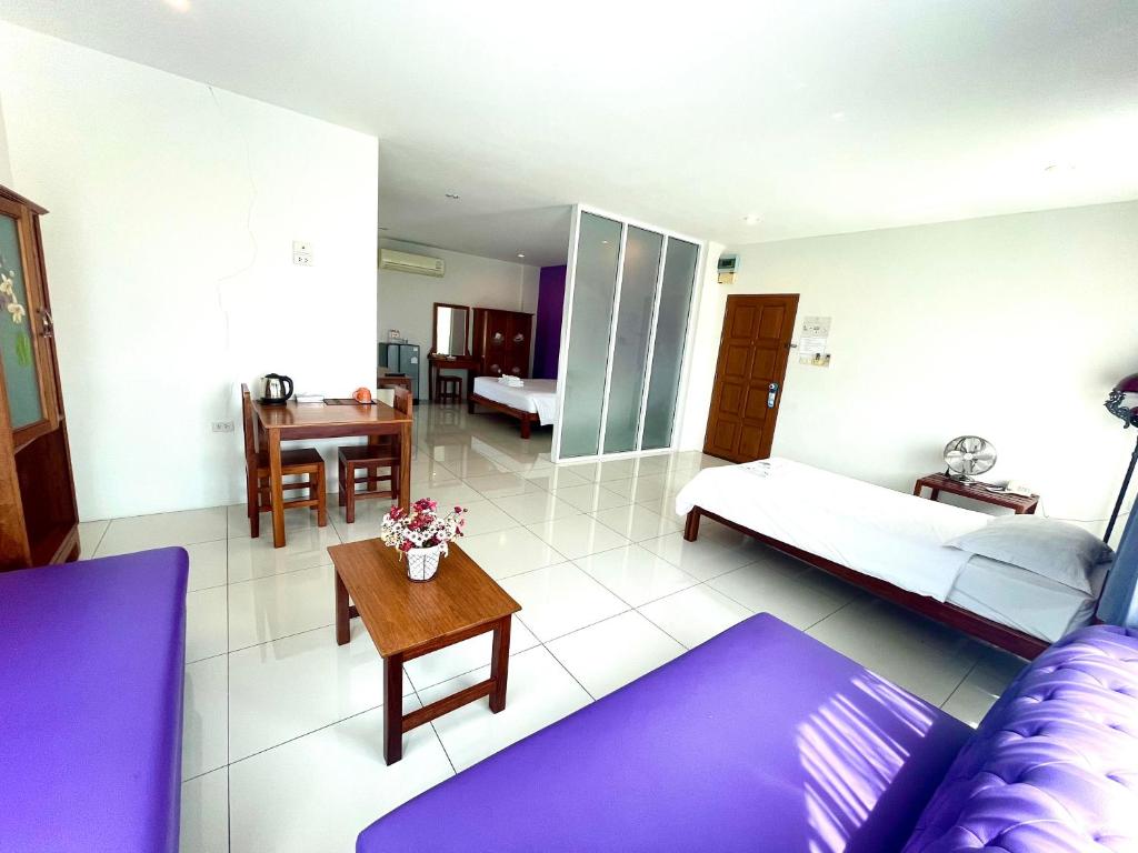 Postel nebo postele na pokoji v ubytování Smile Hua-Hin Resort - SHA Plus