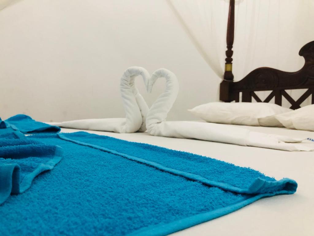 Ένα ή περισσότερα κρεβάτια σε δωμάτιο στο Jungle View Guesthouse Unawatuna