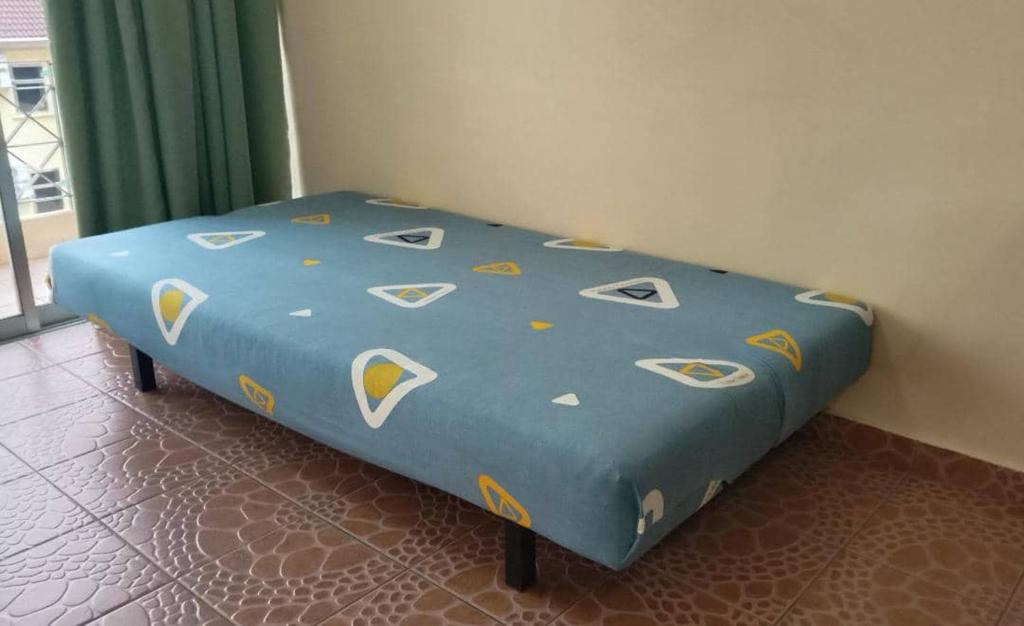 Postel nebo postele na pokoji v ubytování Apartment Teluk Batik
