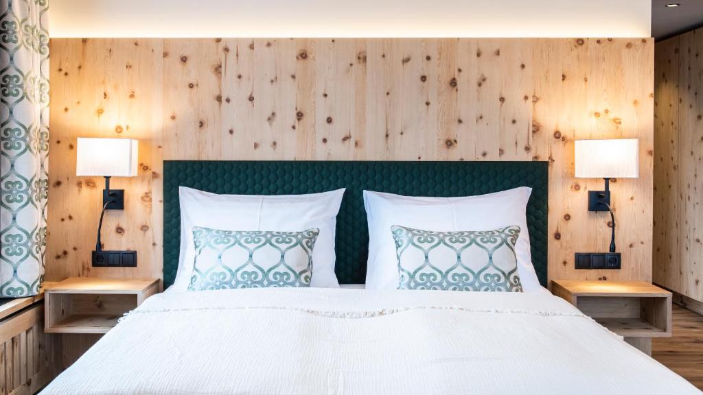 Ein Bett oder Betten in einem Zimmer der Unterkunft Natur Resort RISSBACHER