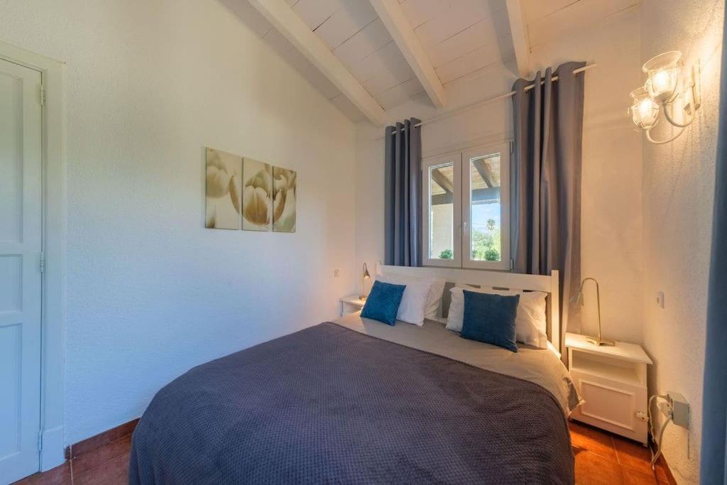 Postel nebo postele na pokoji v ubytování Magnifica Villa tranquila en el centro de Mallorca