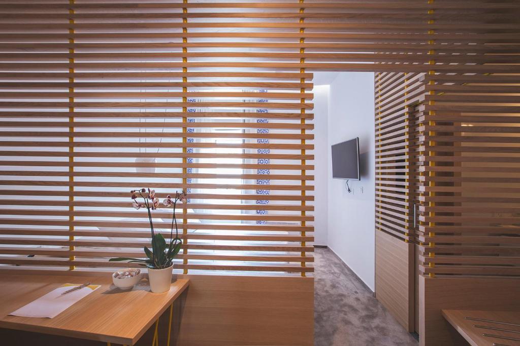 TV a/nebo společenská místnost v ubytování Bed & Atmosphere Rooms