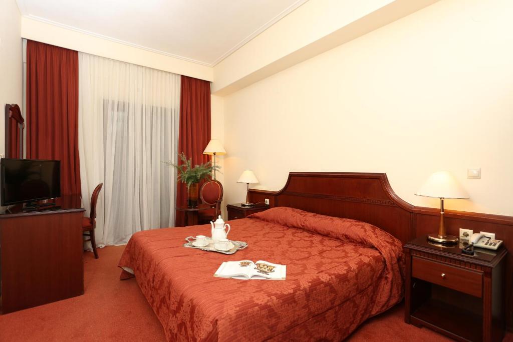 Postel nebo postele na pokoji v ubytování Hotel Apollonia Delphi