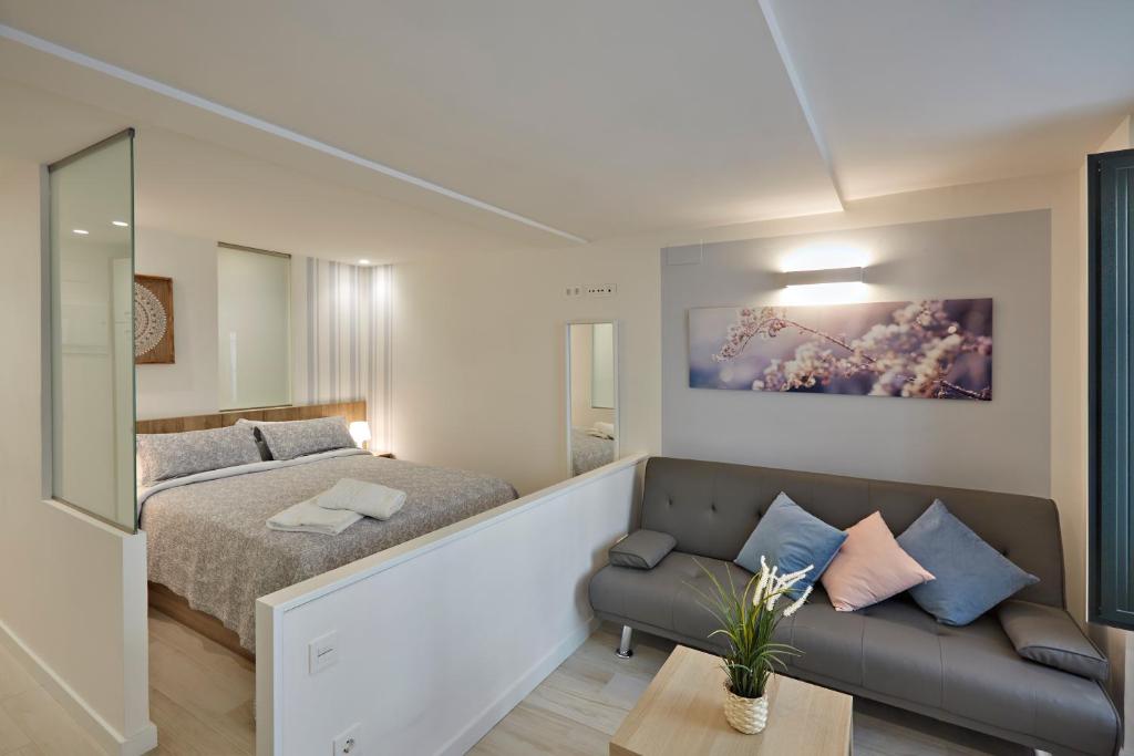 Ένα ή περισσότερα κρεβάτια σε δωμάτιο στο Apartamentos Abastos