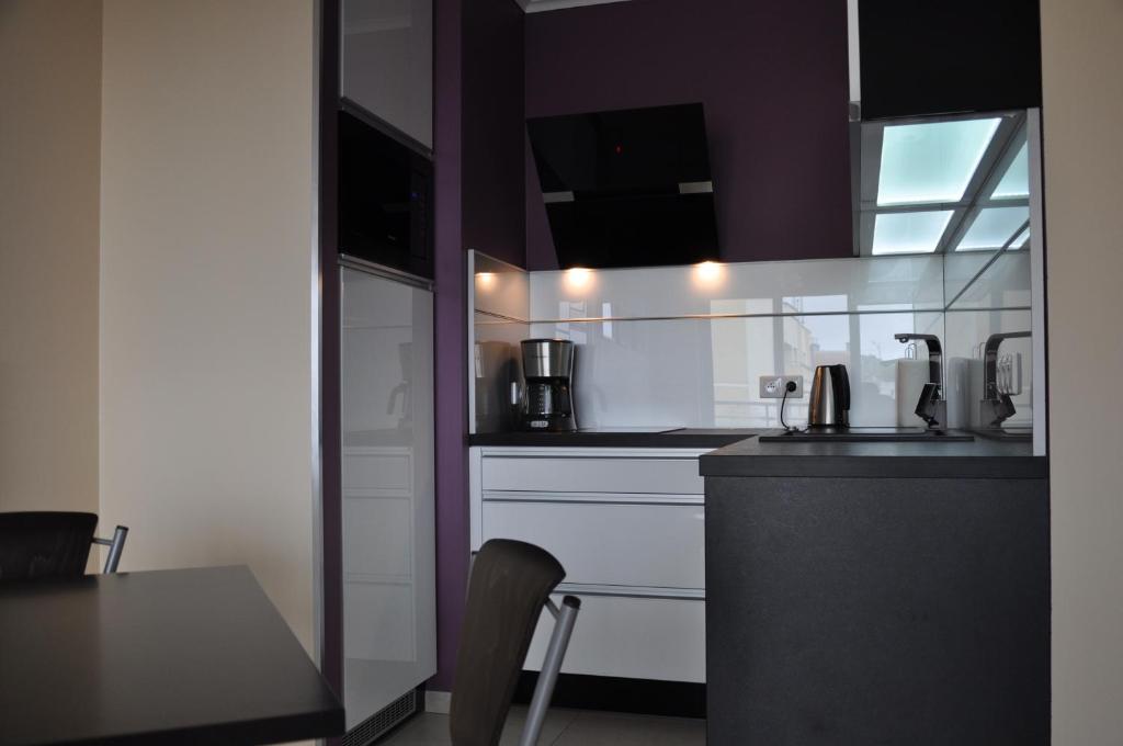 Kuchyň nebo kuchyňský kout v ubytování Promenada28pl - Apartamenty z widokiem na morze