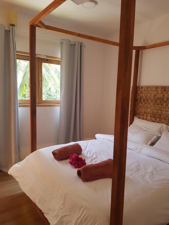 Postel nebo postele na pokoji v ubytování Island Zephyr
