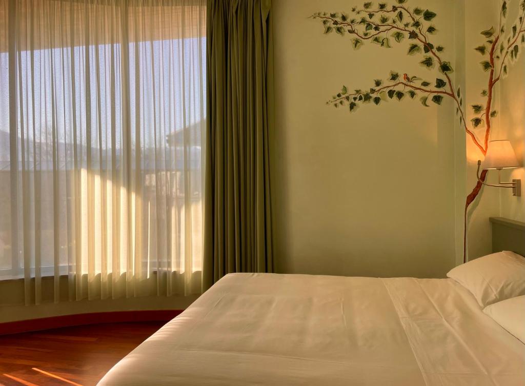 Postel nebo postele na pokoji v ubytování Hotel Santacroce Meeting