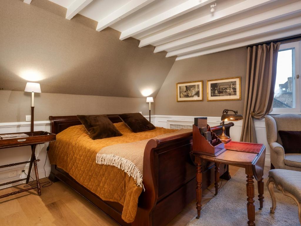 Postel nebo postele na pokoji v ubytování B&B Maison le Dragon