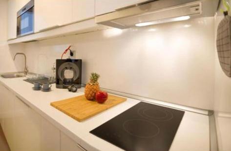 A kitchen or kitchenette at Cosy Seaview Apartment Las Canteras