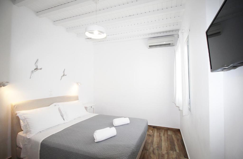 Postel nebo postele na pokoji v ubytování Crystal View Mykonos