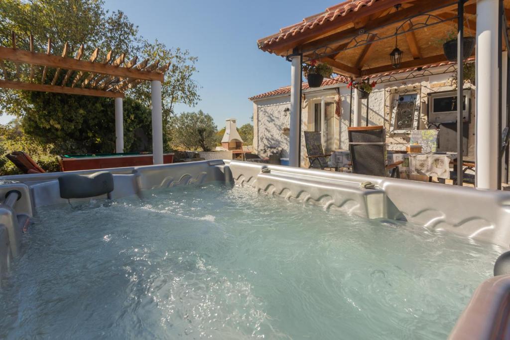 a plunge pool in a backyard with at Anica&Jaglica in Brištane