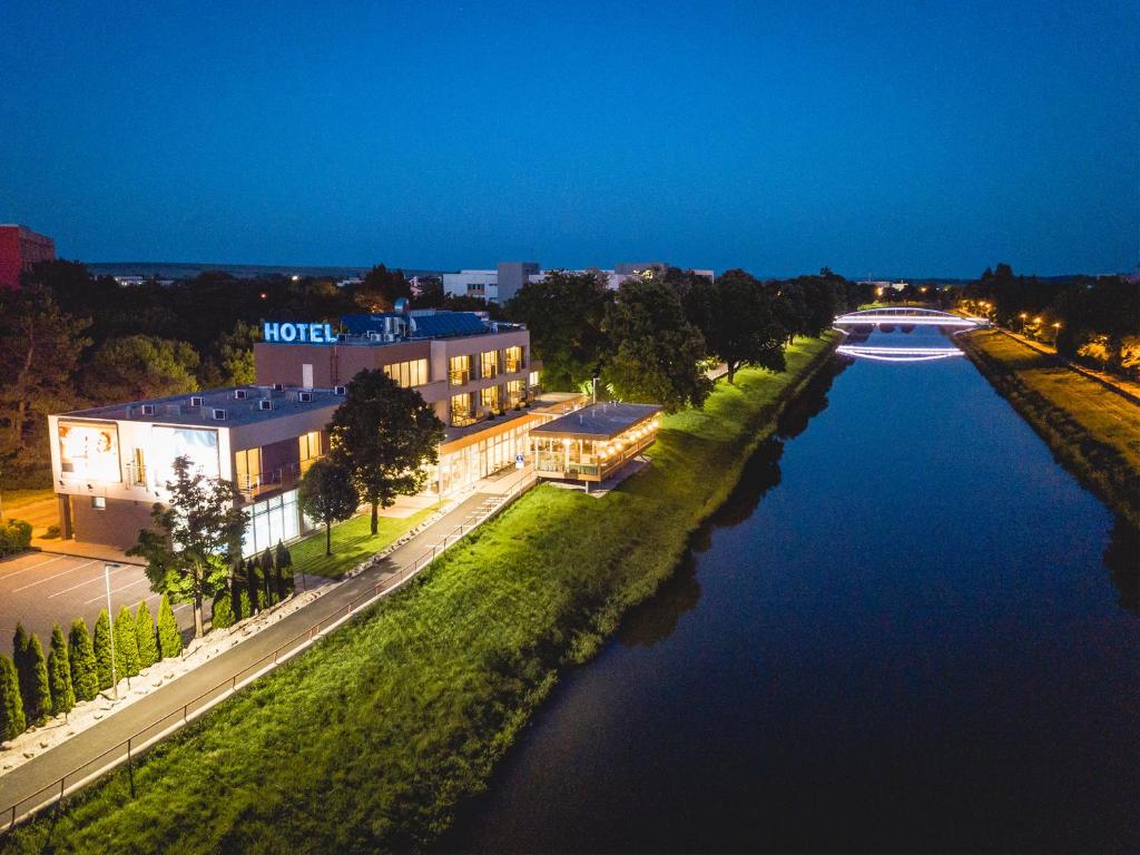 an aerial view of a river at night at Hotel River in Nitra
