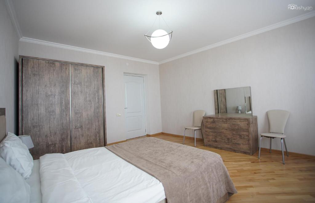 Postel nebo postele na pokoji v ubytování Zurabashvili Guest House