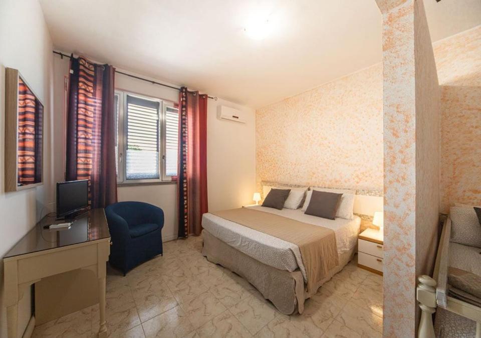 Postel nebo postele na pokoji v ubytování Albergo Luisss