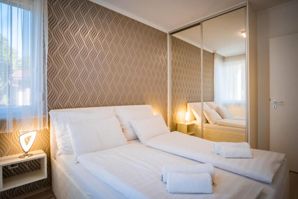 Postel nebo postele na pokoji v ubytování MyFlat Diamond Bay Apartment