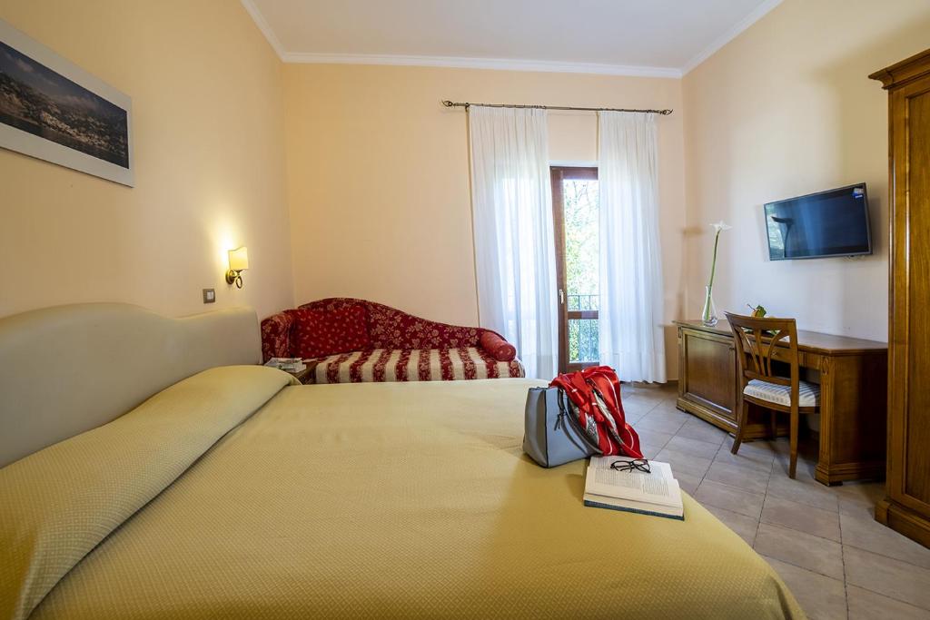 Postel nebo postele na pokoji v ubytování Il Roseto
