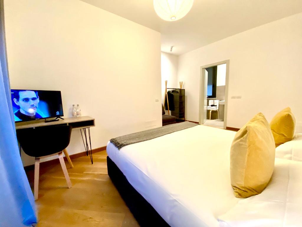 Postel nebo postele na pokoji v ubytování Palazzina B - Smart Rooms