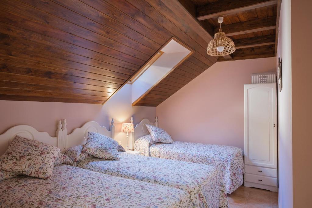 Postel nebo postele na pokoji v ubytování El Rincón de Andrea Apartamentos