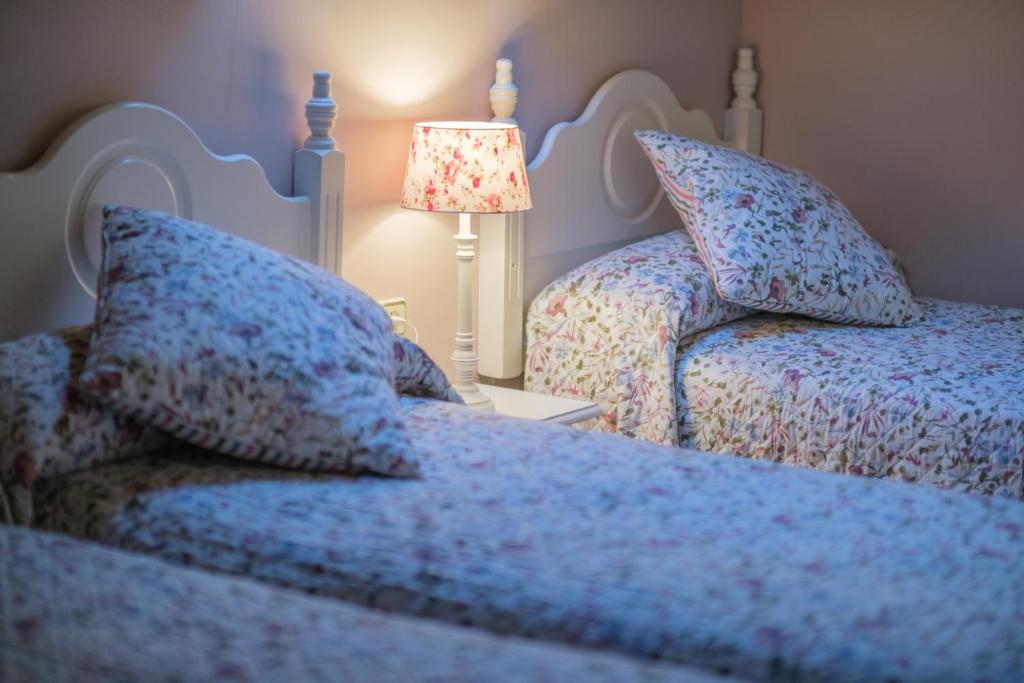 Postel nebo postele na pokoji v ubytování El Rincón de Andrea Apartamentos