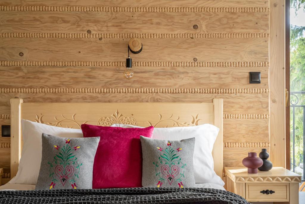 Postel nebo postele na pokoji v ubytování Highlander Heart Residence
