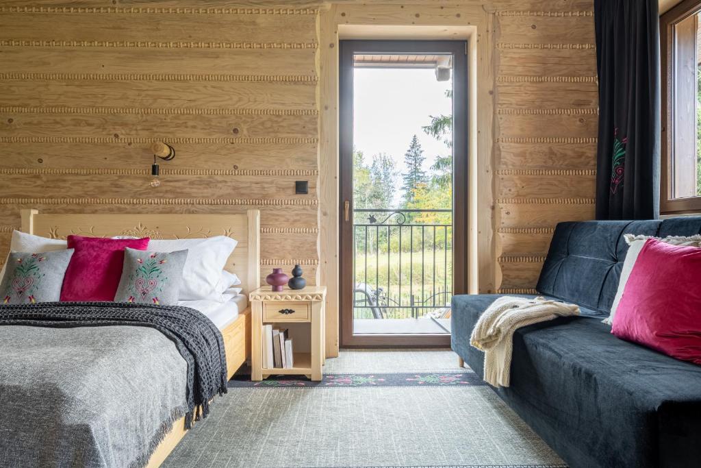 Postel nebo postele na pokoji v ubytování Highlander Heart Residence
