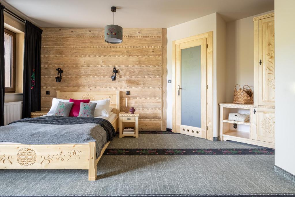 Postel nebo postele na pokoji v ubytování Highlander Heart Residence
