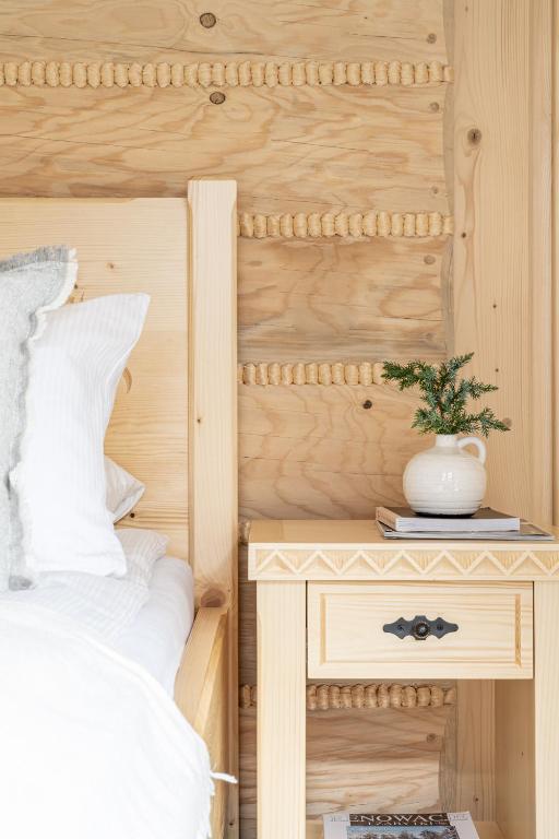 Postel nebo postele na pokoji v ubytování Highlander Heart Residence