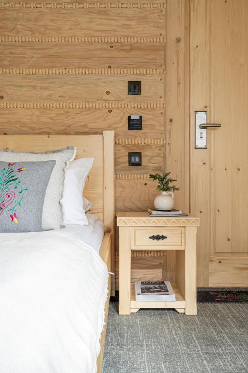 Postel nebo postele na pokoji v ubytování Highlander Heart Residence
