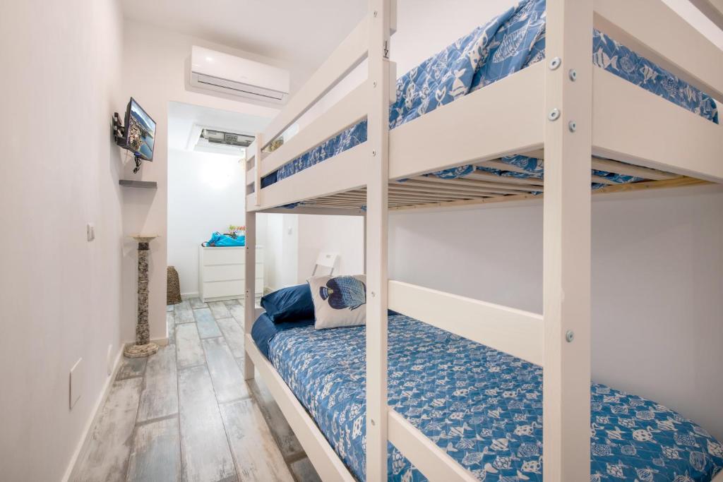 Postel nebo postele na pokoji v ubytování Il Ciottolo Sorrento