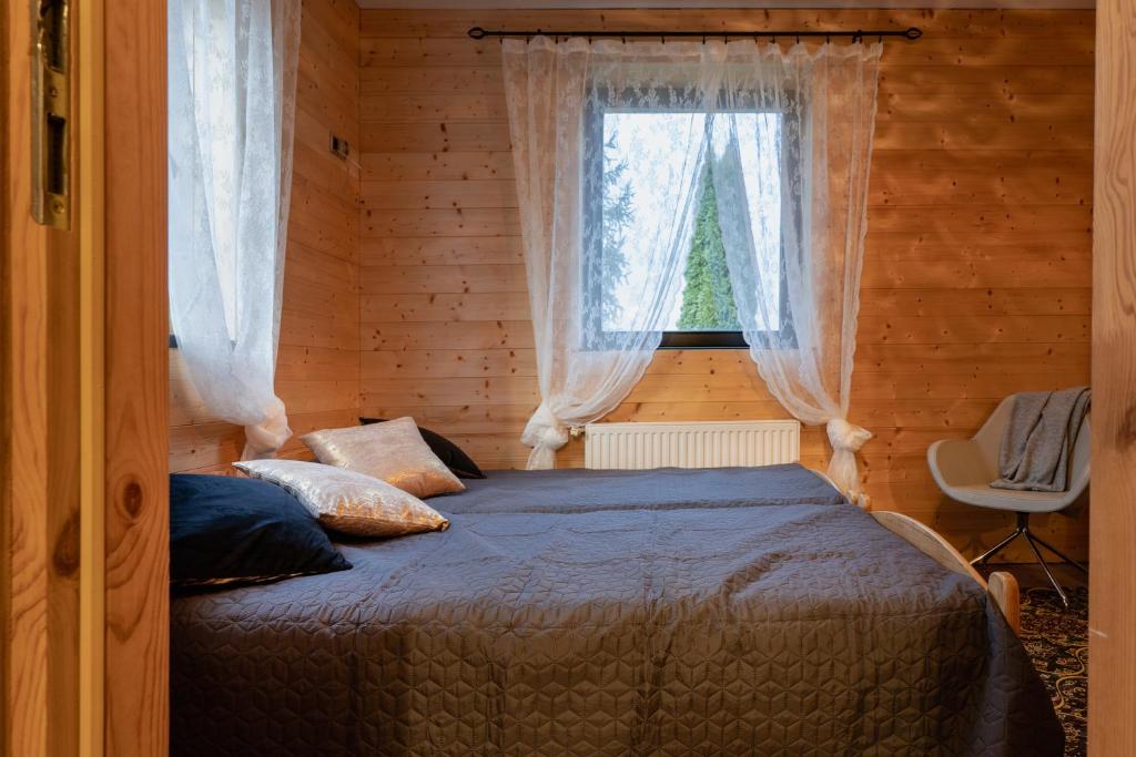 Postel nebo postele na pokoji v ubytování PUSTELNIA WODZA