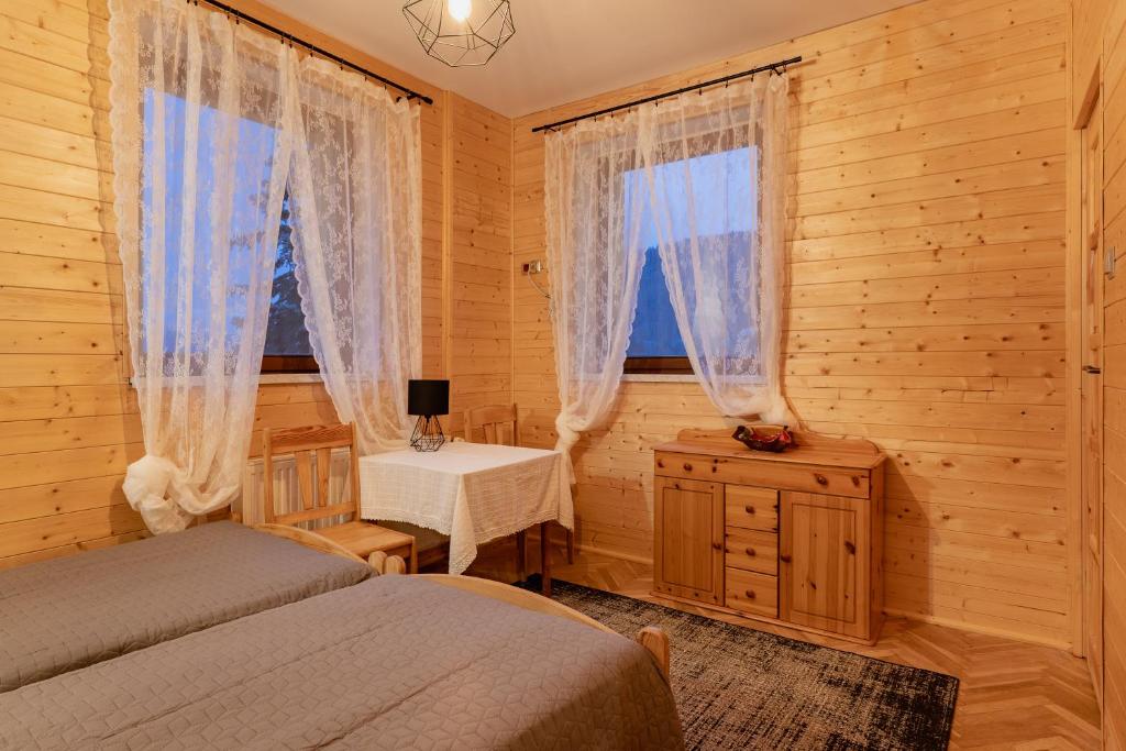 Postel nebo postele na pokoji v ubytování PUSTELNIA WODZA