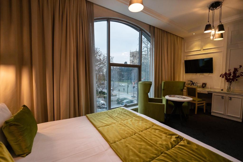Dondar Hotel Formula 1 View tesisinde bir odada yatak veya yataklar