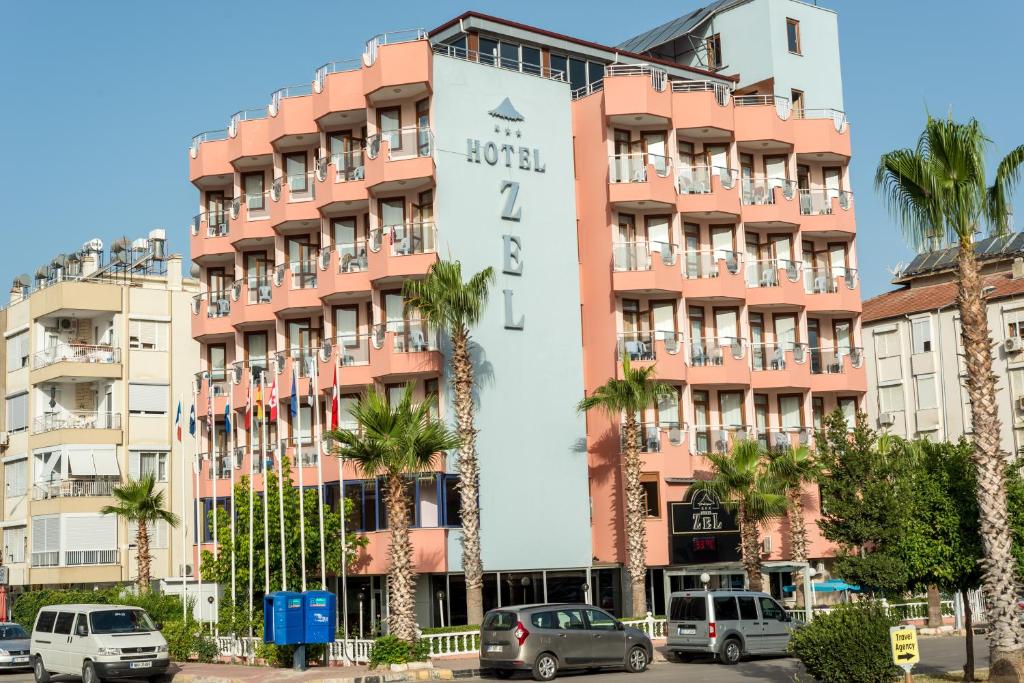 a large building with a clock on the side of it at Zel Hotel in Antalya