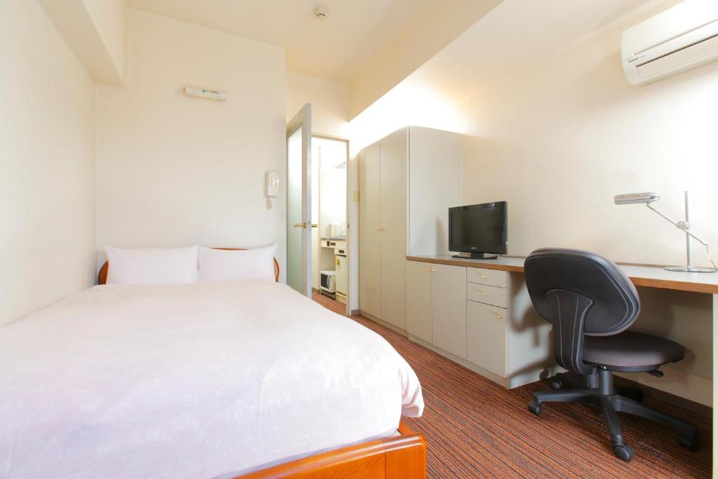 Postel nebo postele na pokoji v ubytování FLEXSTAY INN Shinurayasu