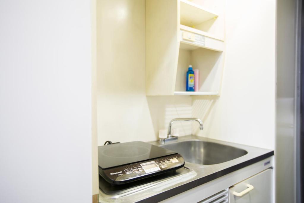 Kuchyň nebo kuchyňský kout v ubytování FLEXSTAY INN Shirogane