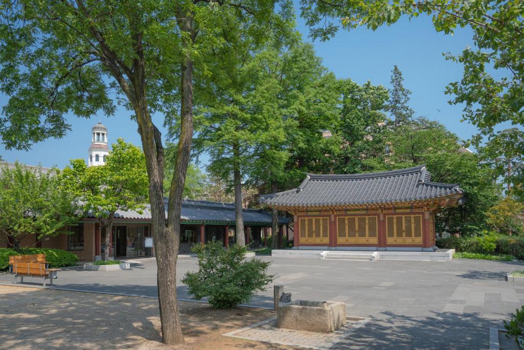a building with a pagoda in the middle of a park at Mayfield Hotel Seoul in Seoul
