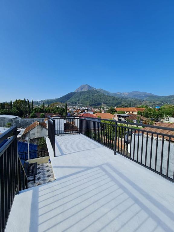 a balcony with a view of a city at Samadi Villa Batu in Batu