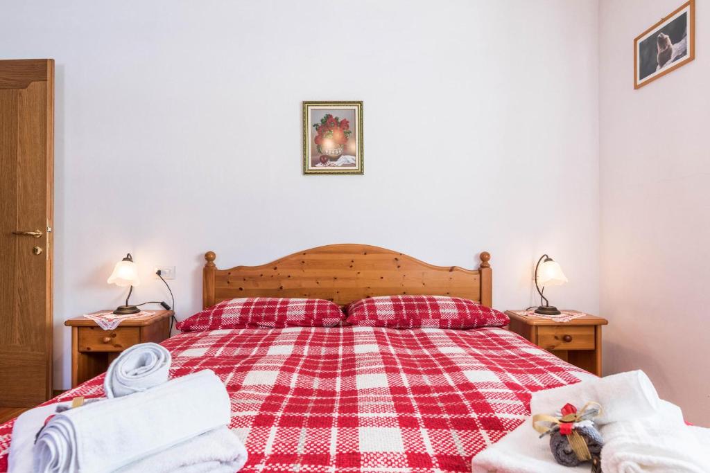 Łóżko lub łóżka w pokoju w obiekcie Agritur Alle Quattro Stagioni
