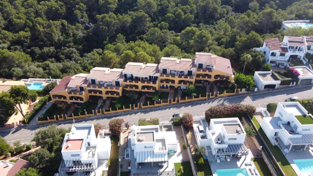 an aerial view of a city with white houses at Appartamento Marianda - Son Bou in Son Bou