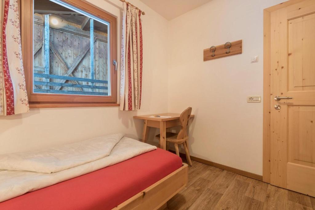 Postel nebo postele na pokoji v ubytování Schildberghof Ortler