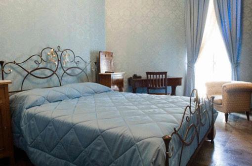 Postel nebo postele na pokoji v ubytování Grana Barocco Art Hotel