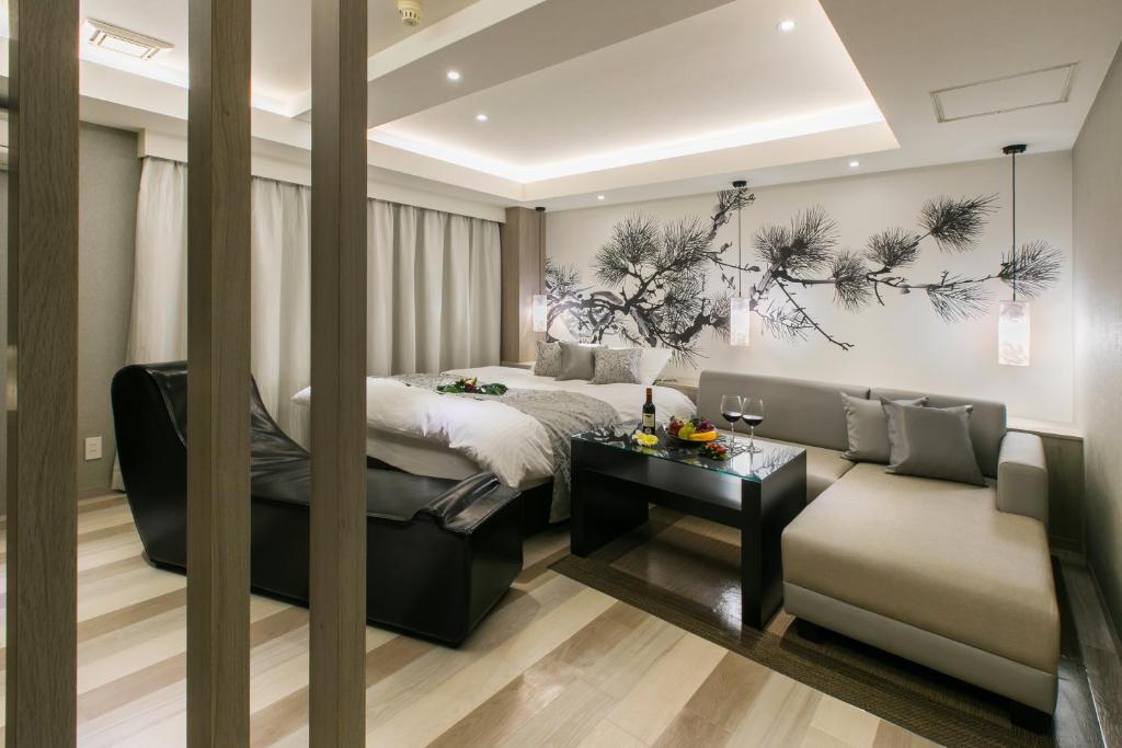 Postel nebo postele na pokoji v ubytování HOTEL 粋