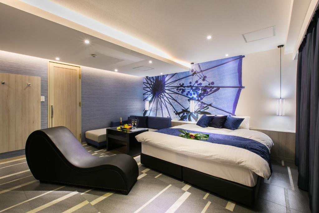 Postel nebo postele na pokoji v ubytování HOTEL 粋