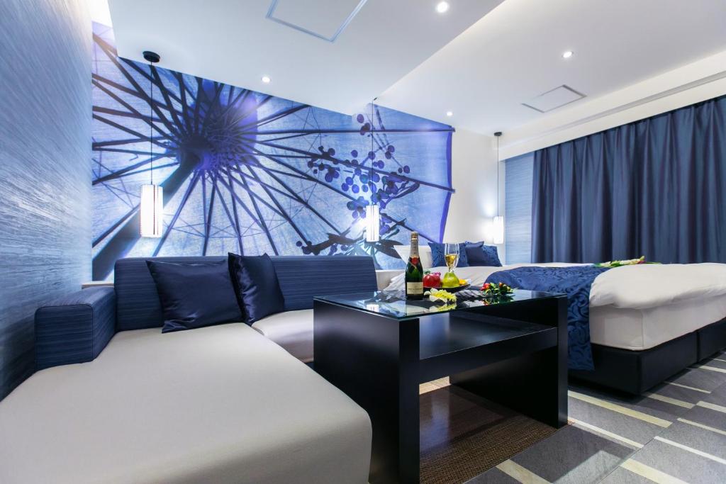 Postel nebo postele na pokoji v ubytování HOTEL 粋