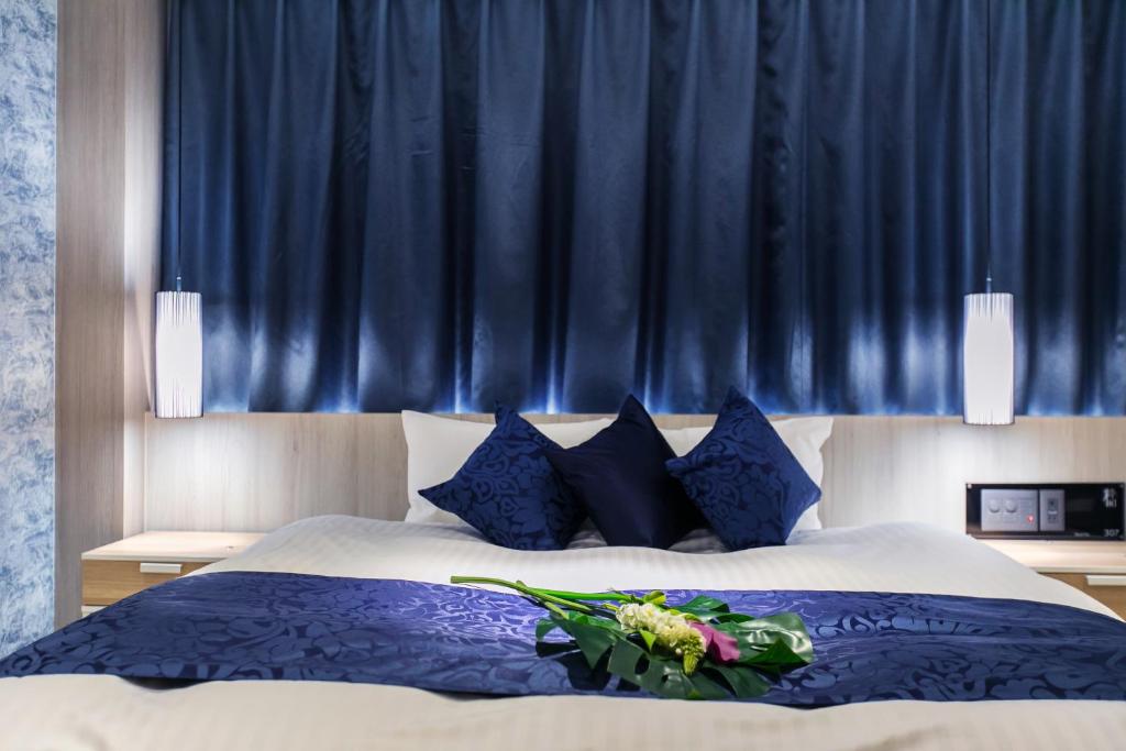 Postel nebo postele na pokoji v ubytování HOTEL 粋
